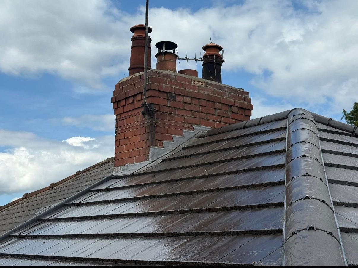 Chimney after the work, showing rebuilt upper brickwork